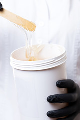 Tube with means for hair removal on body close-up