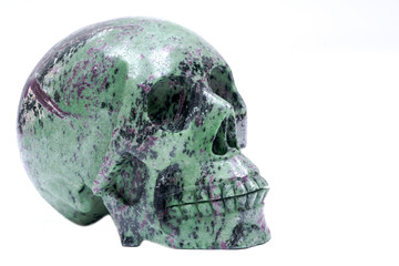 Ruby Zoisite realistic crystal carved skull isolated on white background