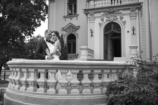 Young bride posing near groom
