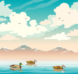 Fototapeta na wymiar Landscape with ducks, lake, mountains and cloudy sky.
