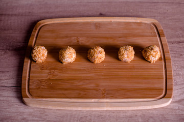 Tasty cheese balls served in the wooden plate