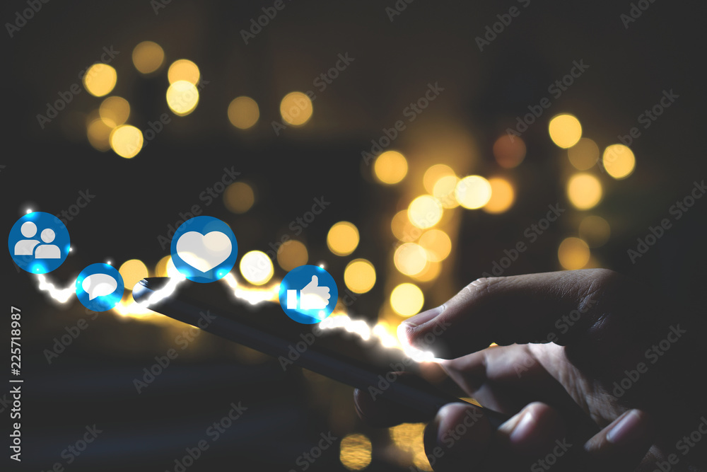 Poster man using smart phone on night. social media concept.