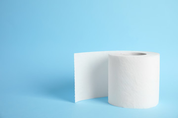 Toilet paper roll on color background. Space for text