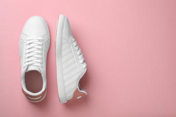 Pair of sneakers on color background, flat lay. Space for text