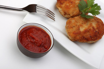 roasted pork and beef cutlets on plate