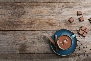 Zelfklevend Fotobehang Cup of hot chocolate on wooden background, flat lay. Space for text © New Africa