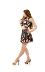 A young girl with long hair and a short dress.