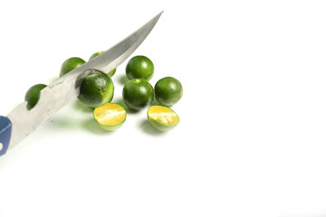 Green lemons isolated on white background