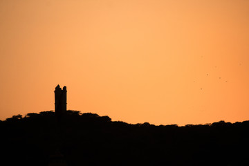 Obraz premium silhouette of the lighthouse at sunset