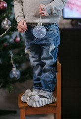 Boy decorating Christmas tree