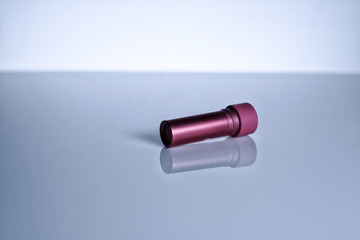 Dark Rose Pink Lipstick on white isolated background