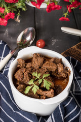 Beef meat stew in ceramic pot.