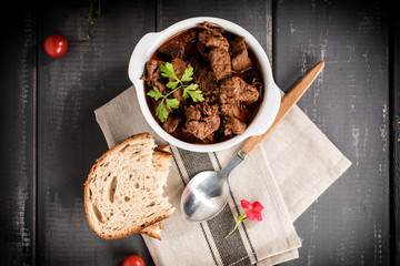 Beef meat stew in ceramic pot.