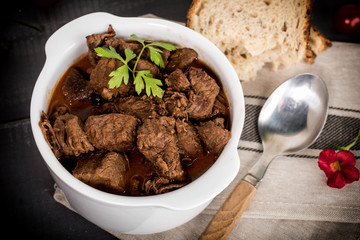 Beef meat stew in ceramic pot.