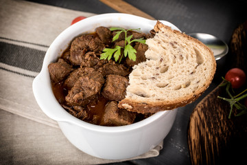 Beef meat stew in ceramic pot.