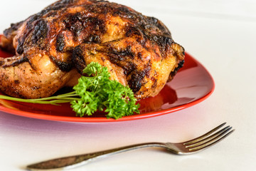 grilled chicken on a red plate
