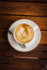 cup of coffee on wooden table