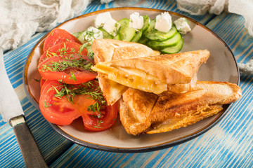 Obraz na płótnie Canvas Sandwiches with cheese, tomatoes and cucumber.