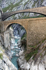 Modern bridge and a tunnel at the Devil's bridge at St.Gotthard, Switzerland