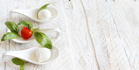 Italian cheese mozzarella with tomatoes and basil