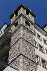 Fragment of a castle-style building with a tower