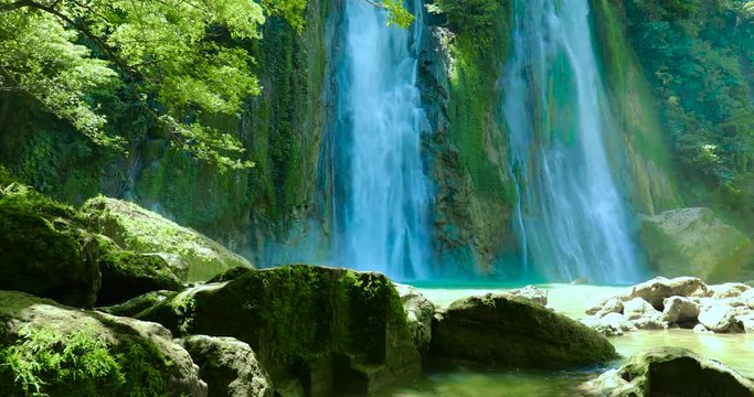 Beautiful scenery of Cikaso waterfall with rocks in Sukabumi, West Java, Indonesia. Shot in 4k resolution