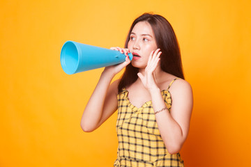 Beautiful young Asian woman announce with megaphone.