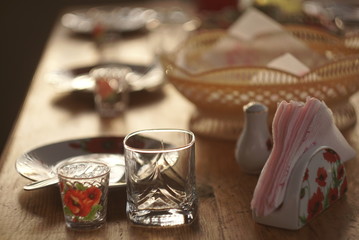 Glasses and plates on table - food background 
