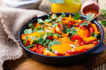 Shakshuka, fried eggs cooked in tomatoes and bell peppers sauce