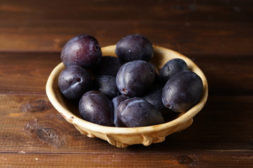 fresh plums in a bowl