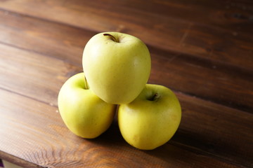 apples on wooden table