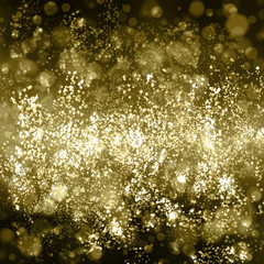 Abstract gold background with bokeh. Yellow and light brown blur