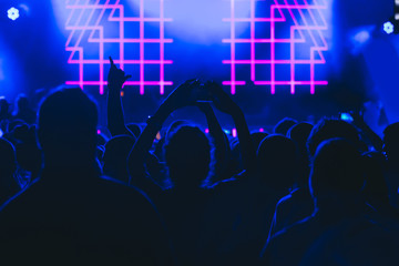 Crowd at a concert with hands up