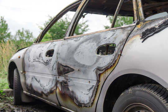 Burned out car after a car accident. Outside view.