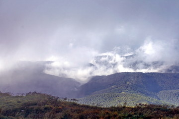 Clouds and fog over mountains. The Carpathian Mountains. Montenegrin Range. The national biosphere reserve of Hoverla.