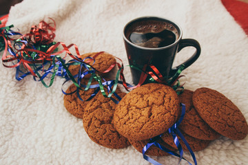 Obraz na płótnie Canvas New Year and Christmas. Serpentine and garlands. Ginger and oatmeal cookies. New Year sweets. White background.
