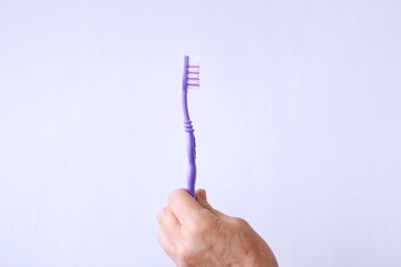 toothbrush in the hands of a woman