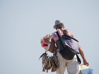 street vendor with dried fish and colorful candy