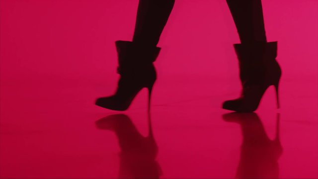 Loop of Close, woman in high heels walks with red abstract
