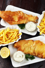 traditional British fish and chips consisting of fried fish, potato chips and mayonnaise