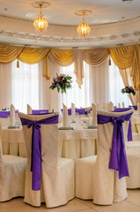 The restaurant is decorated with wedding decor, Banquet hall . The table of the bride and groom
