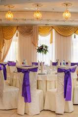The restaurant is decorated with wedding decor, Banquet hall . The table of the bride and groom