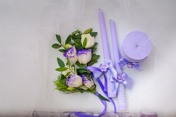 The restaurant is decorated with wedding decor, Banquet hall . The table of the bride and groom . candles decorated with hand work , purple color .,
