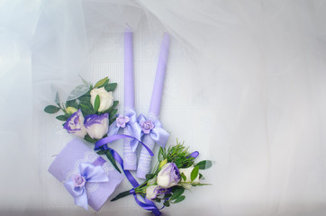 The restaurant is decorated with wedding decor, Banquet hall . The table of the bride and groom . candles decorated with hand work , purple color .,