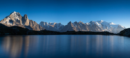 Panorama of the Alps near Chamonix, with Aiguille Verte, Les Drus, Auguille du Midi and Mont Blanc, during sunset.