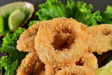 Deep fried tempura squid rings and salad