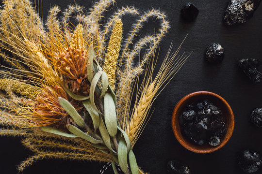 Dried Feather Grass and Flowers with Wood Bowl of Apache Tears and Obsidian