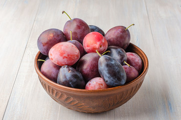 Plums on a light background.