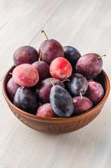 Plums on a light background.