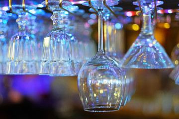 beautiful crystal glasses hanging in the bar